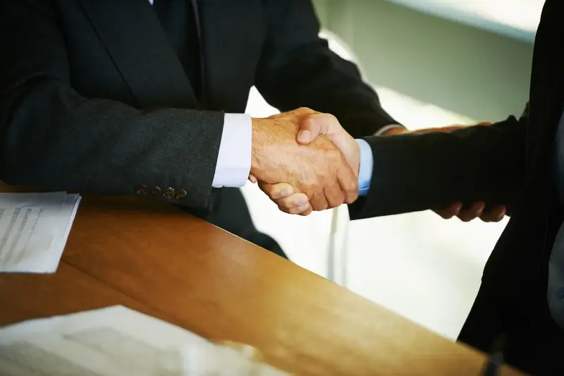 Stock image of two businessmen shaking hands.