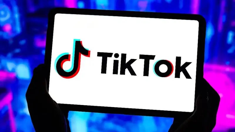 In this photo illustration, the TikTok logo is displayed on...