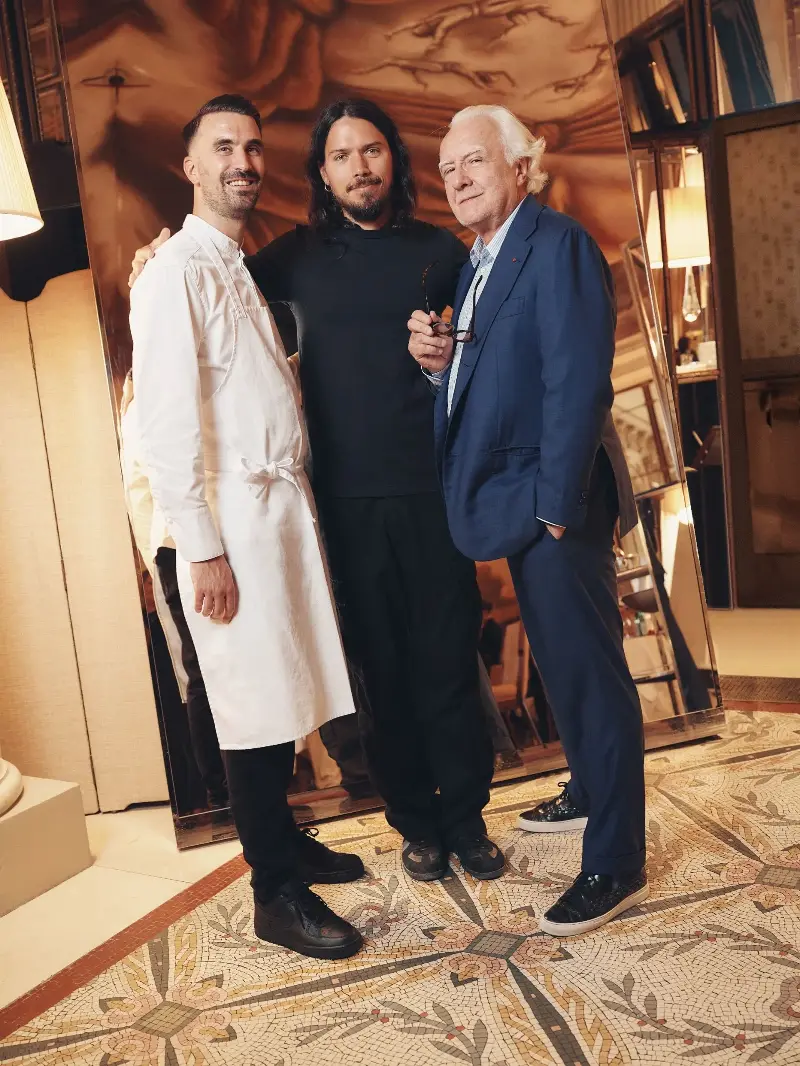 Designer Harry Nuriev, photographed alongside esteemed chefs Alain Ducasse and Amaury Bouhours, his collaborators for this new pop-up activation at Le Meurice. (Image credit: Courtesy of Harry Nuriev and Le Meurice)