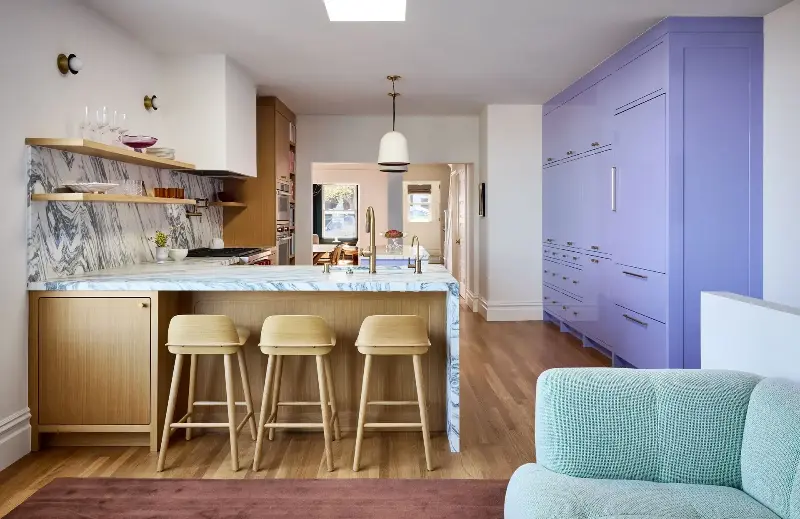 There's nothing like a run of floor-to-ceiling periwinkle cabinetry to liven a kitchen up. (Image credit: John Merkl. Design: Clara Jung. Styling: Kay Jaramillo. Architect: Jack Backus. Builder/Contractor: North Bay Construction)