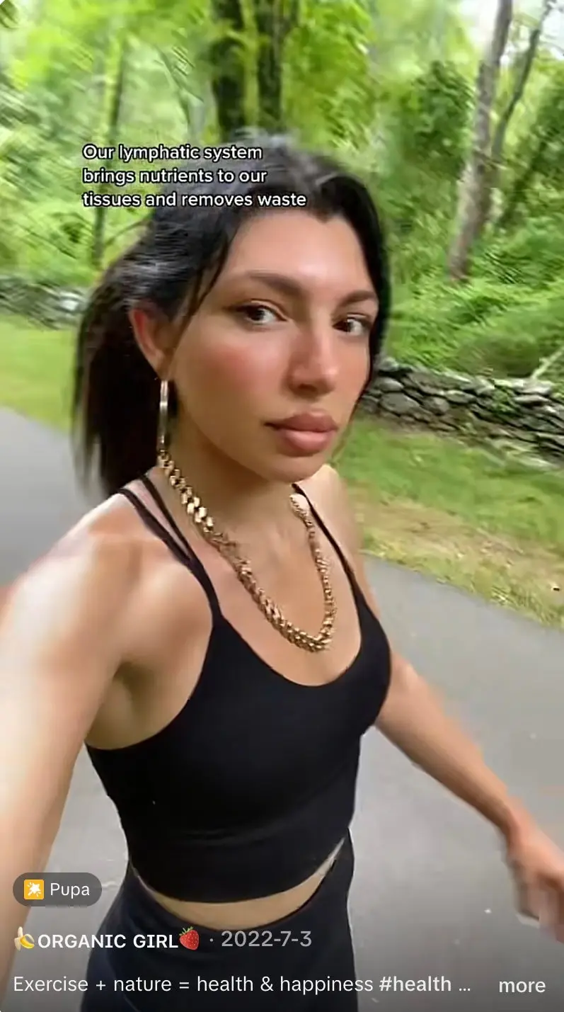 One TikTok user swings her arms while lymphatic walking. Experts say just getting up and moving is the key to regulating the lymphatic system (@organic_girlx/TikTok)