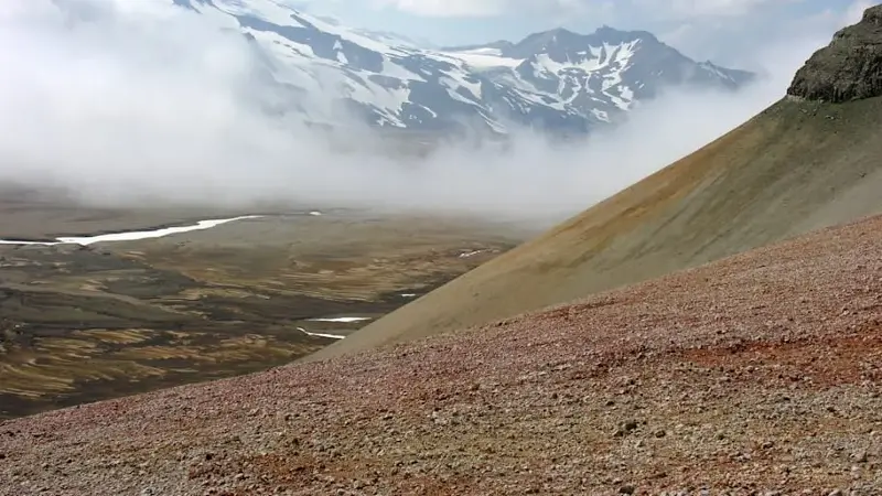 Red-tinted ash from the Novarupta eruption blankets a portion of the Valley of Ten Thousand Smokes in Alaska.