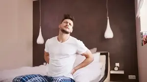 Waking up with stiff back? Spine surgeon explains when morning stiffness is major warning sign