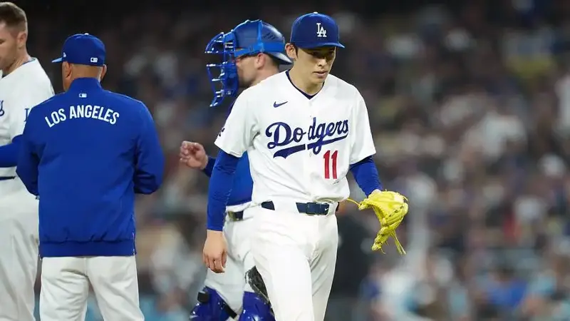 Los Angeles Dodgers pitcher Roki Sasaki (11) walks back to the dugout
