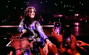Billie Eilish defends Gen Z filming concerts on phones