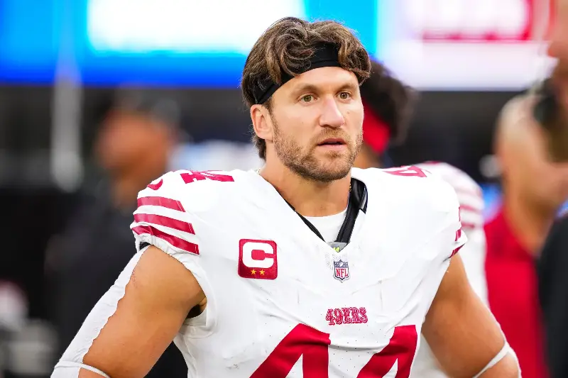 INGLEWOOD, CA - OCTOBER 02: Kyle Juszczyk #44 of the San Francisco 49ers looks on from the sideline during the national anthem prior to an NFL football game against the Los Angeles Rams at SoFi Stadium on October 2, 2025 in Inglewood, California. (Photo by Cooper Neill/Getty Images)