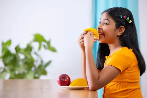 Mangoes are enjoyed by children and adults alike.