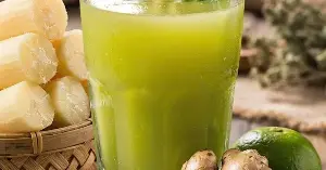 What are the benefits of adding ginger to sugarcane juice?