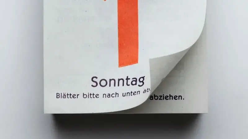 A German daily calendar showing New Year's Day with curled up page corner