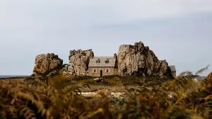 This 160-year-old tiny French cottage is squeezed between two rocks and off limits to tourists: Here's why