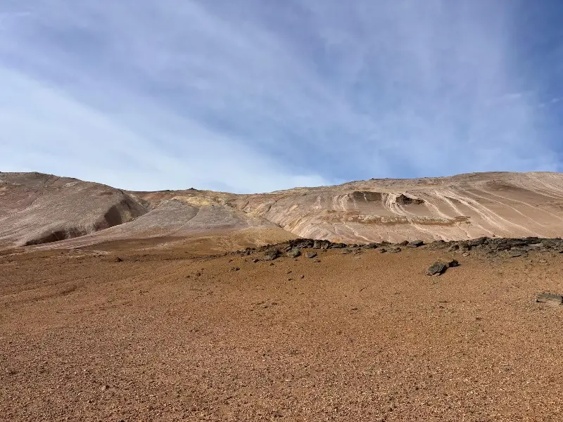Beautiful landscape of rhyolite hills under a clear blue sky in Þingeyjarsveit, Iceland.