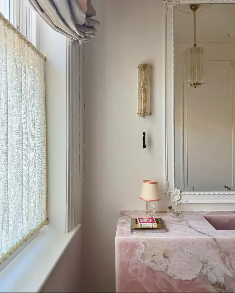 A black tassel light pull by Jessica Light for East London Cloth adds a touch of ornamentation to this glass wall light (Image credit: East London Cloth)