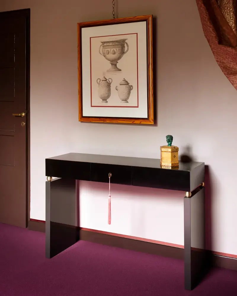 Giuseppe Porcelli, known for his trademark blend of nostalgia and modernity, offset this sleek black console with a single tassel hanging from its key.  (Image credit: Giuseppe Porcelli)