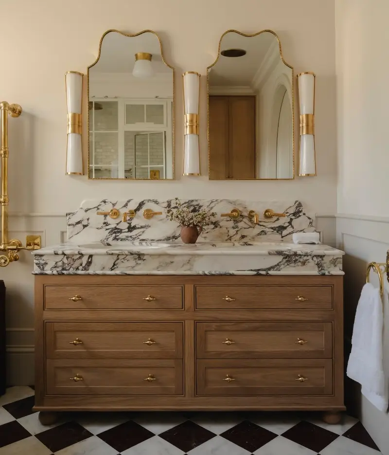 Depending on the piping situation, you may be able to add significant storage by repurposing a sideboard or chest of drawers for use in the bathroom