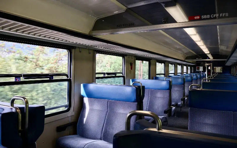While most of the train’s carriages have large curved windows, the flat windows in the photo carriage are meant to be opened