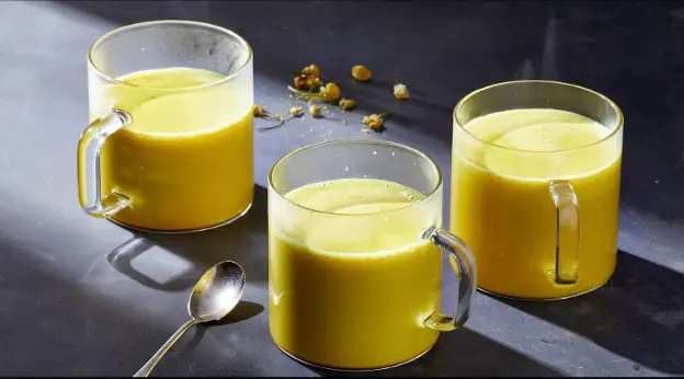 Chamomile, milk, honey, and turmeric come together to make a soothing drink that helps you sleep. 
