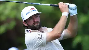 Why does Cameron Young have an MLB logo on his shirt collar?