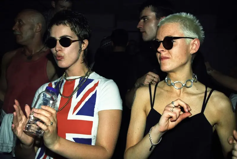 A casual, cool nonchalance became a defining feature for the 90s it kids.  (Image credit: Jon Shard, Flesh at The Haçienda, 1996  Courtesy of British Culture Archive © Jon Shard  British Culture Archive)