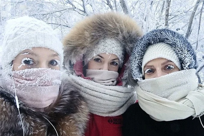 People in Yakutsk cover their faces with scarves and fur hats to avoid frostbite.