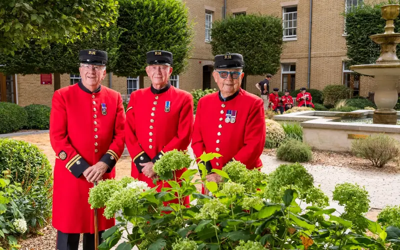 Chelsea Pensioners Bill, John and Archie pictured in the tranquil courtyard garden at the Royal Hospital Chelsea - Andrew Crowley for The Telegraph