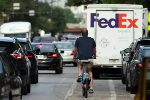 Chicago bike lane ticketing program records big fines against delivery companies