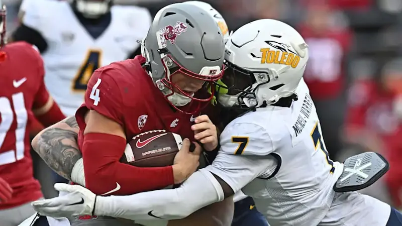 Washington State QB Zevi Eckhaus is tackled by McNeil-Warren in the second half at Gesa Field at Martin Stadium.