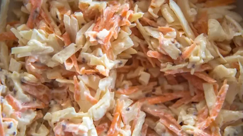 Close up of coleslaw with mustard seeds