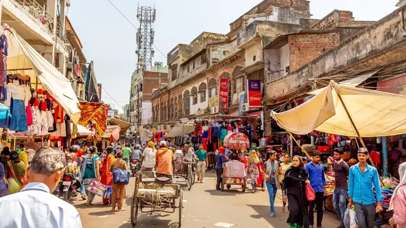 Busy street with rickshaw in New Delhi,India