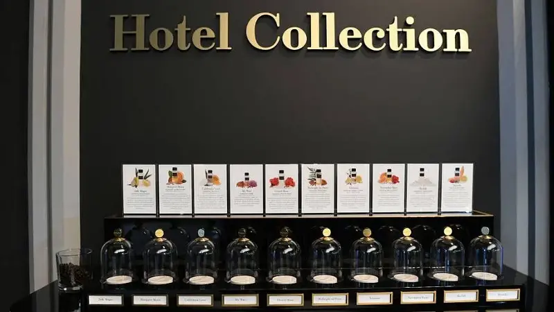 Perfumes below sign reading 