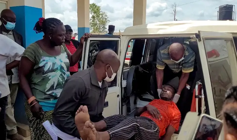 A man is carried from an ambulance following confirmation of an Ebola outbreak involving the Bundibugyo strain.