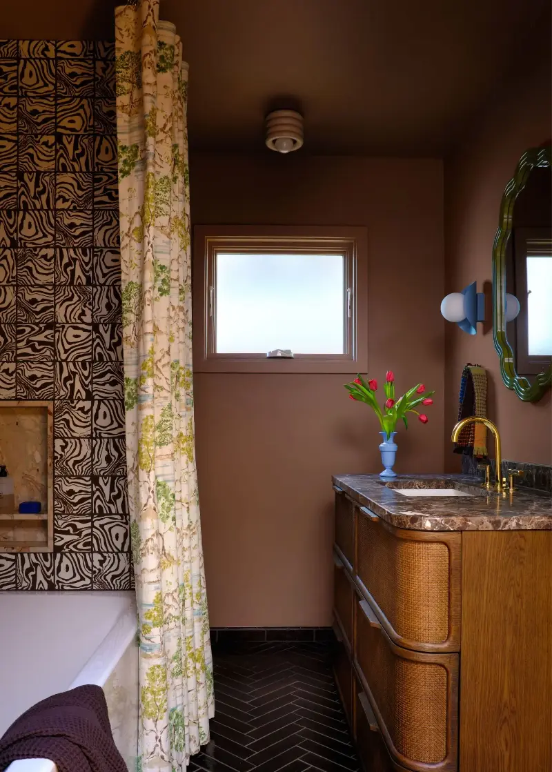 The wall, floor, and baseboard tiles create a continuous, architectural backdrop. (Image credit: Suzanna Scott Photography. Design: Spearman Spaces)