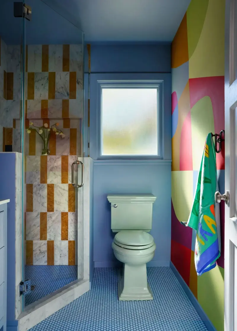 The kids' bathroom is a myriad of colors. Suzanna Scott Photography. Design: Spearman Spaces