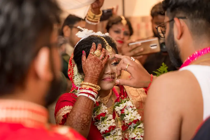 It is a cultural marker of marriage in Bengali Hindu society, carrying associations with marital identity, auspiciousness, and family traditions.