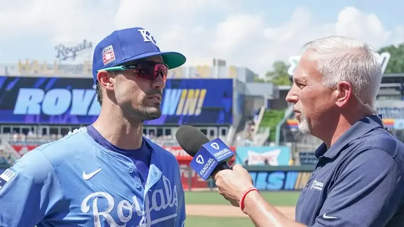 Kansas City Royals right fielder Randal Grichuk (15) is interviewed by FanDuel sports reporter Joel Goldberg