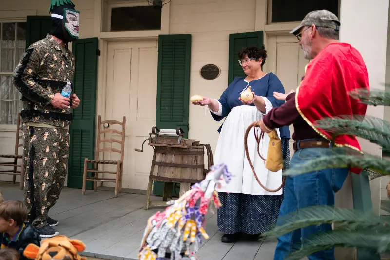 Offering ingredients to cook gumbo at Lafayette Mardi Gras (Jason Cohen)