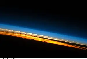 We tend to think of Earth’s atmosphere as a vast protective shield, but astronauts looking back from the ISS see something far more fragile: a thin blue-green line, like the skin of an apple wrapped around a basketball, separating every living thing we know from the complete inhospitality of space.