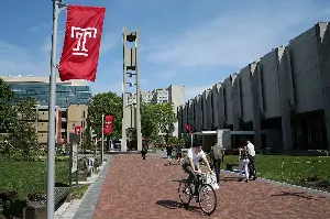 Temple University will lay off employees and raise tuition for the second consecutive year
