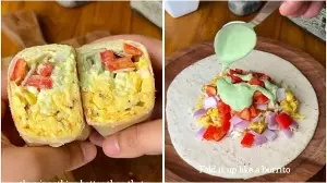 Spice up your mornings with this cheesy scrambled eggs breakfast burrito packed with crunchy veggies and yoghurt sauce