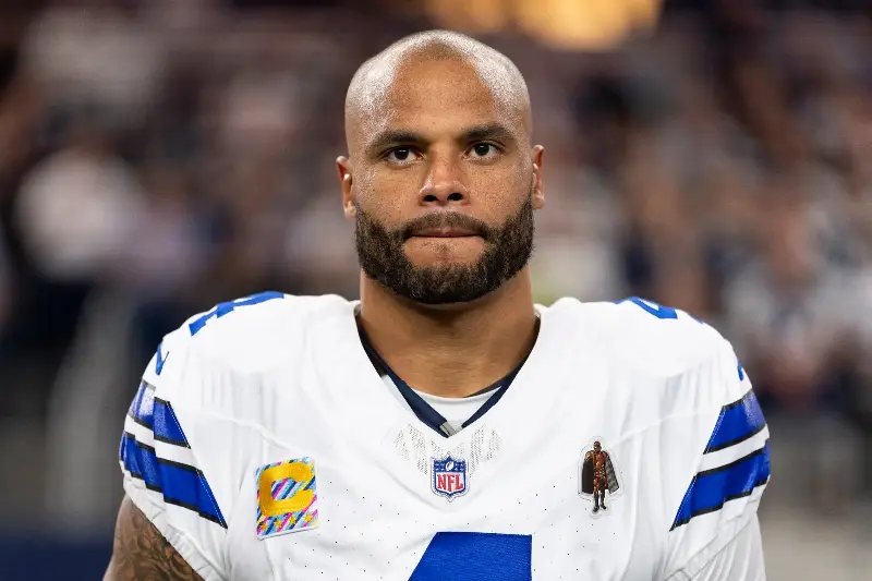 ARLINGTON, TEXAS - OCTOBER 8: Dak Prescott #4 of the Dallas Cowboys looks on against the Tampa Bay Buccaneers during the national anthem prior to an NFL football game at AT&T Stadium on October 8, 2026 in Arlington, Texas. (Photo by Michael Owens/Getty Images)