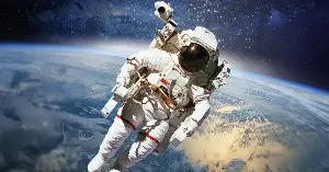 Astronauts on the ISS lose about 1-2% of their bone density per month in microgravity — meaning a six-month mission costs them as much bone mass as a postmenopausal woman loses in a year — and the countermeasures NASA developed to slow that loss are now being studied as treatments for osteoporosis patients on the ground