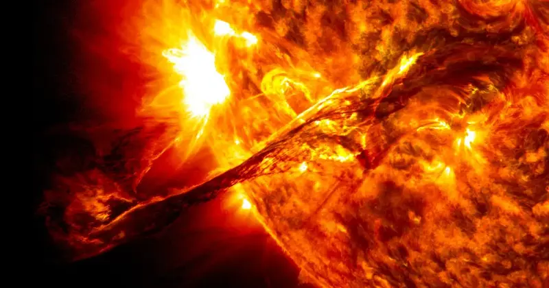 A giant prominence erupts from the Sun, imaged in ultraviolet light by NASA’s Solar Dynamics Observatory.