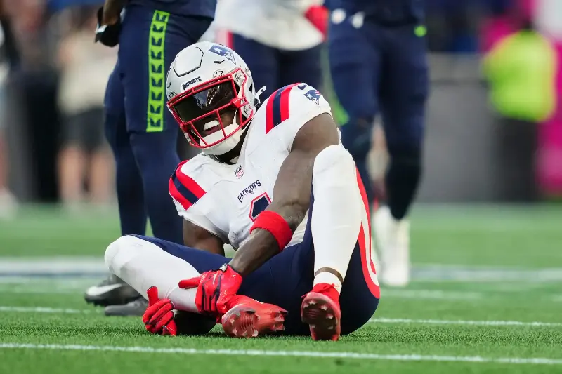 A.J. Brown #1 of the New England Patriots sits on the field with an injury against the Seattle Seahawks during the NFL football game at Lumen Field on September 9, 2026 in Seattle, Washington. (Photo by Cooper Neill/Getty Images)