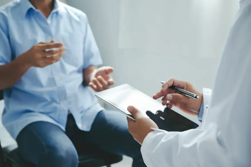 Doctor talking to patients are explaining the treatment of a patient's illness . Health and Medicine concept