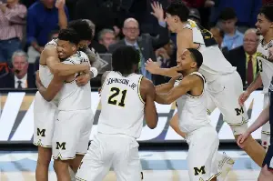Michigan beats stubborn UConn in NCAA Finals
