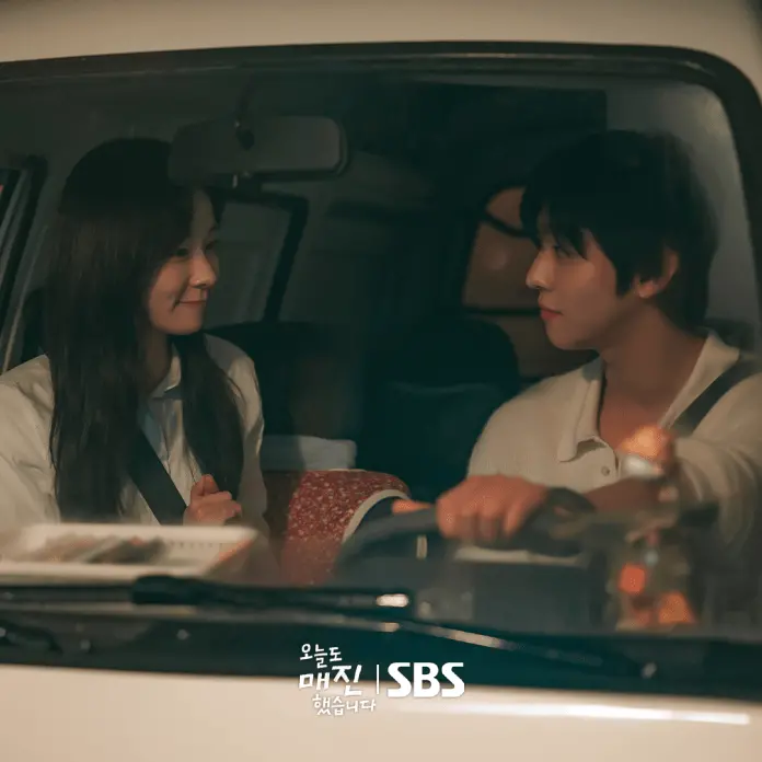 Ahn Hyo Seop sitting in a car, smiling and gazing at each other, creating a warm and intimate atmosphere.