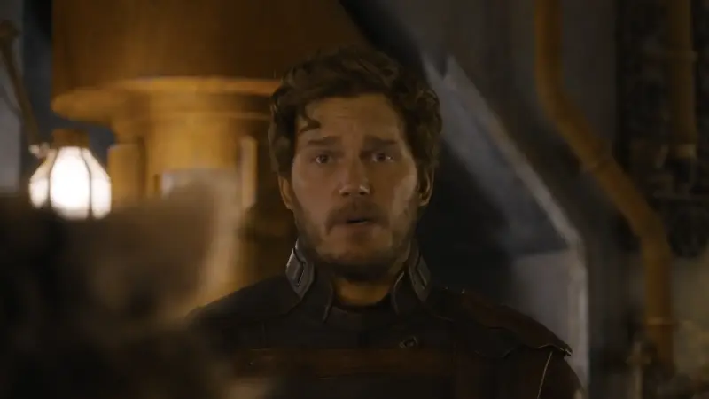 Star-Lord in his uniform talking to Rocket after Guardians 3's final battle.