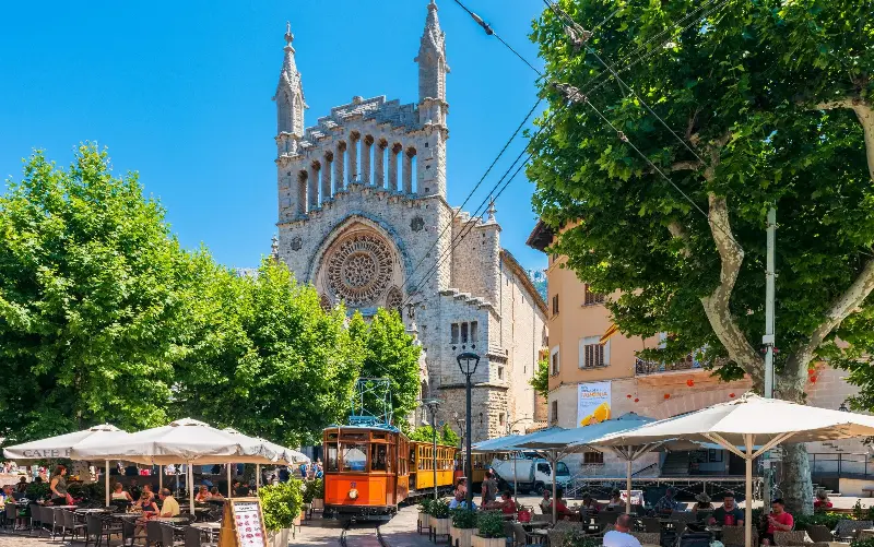 The historic Sóller train runs through the centre of town - Allard1/Getty Images