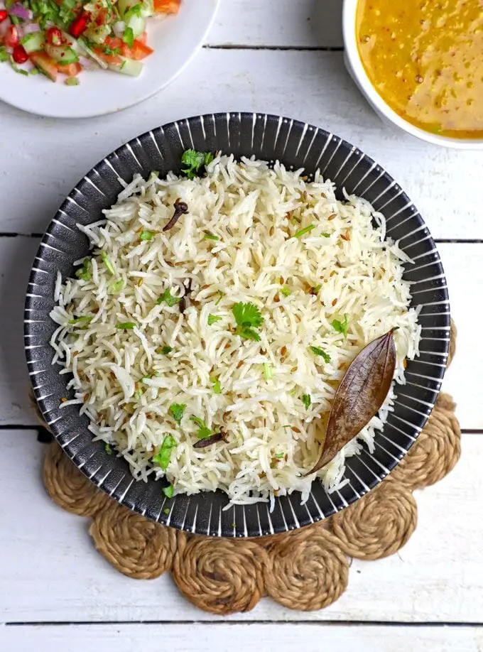 Sanjeev Kapoor’s jeera rice recipe features sautéed basmati rice cooked with aromatic whole spices in ghee.