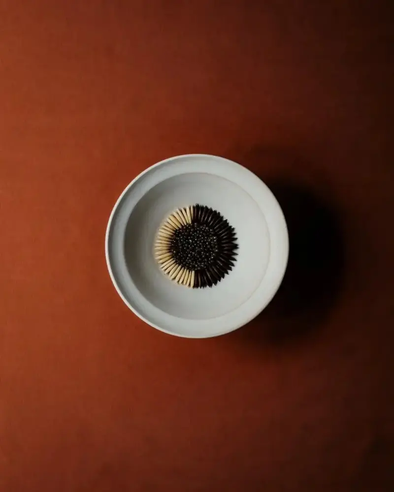 Oscietra Royal caviar with roasted and peeled pumpkin seeds, lightly-steamed brown crab from the west coast of Denmark and cherry blossom oil.