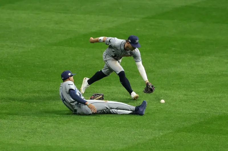 MILWAUKEE, WISCONSIN - OCTOBER 24: Chandler Simpson #14 of the Tampa Bay Rays drops the ball hit by Christian Yelich #22 of the Milwaukee Brewers during the sixth inning in game two of the 2026 World Series at American Family Field on October 24, 2026 in Milwaukee, Wisconsin.  (Photo by Al Bello/Getty Images)